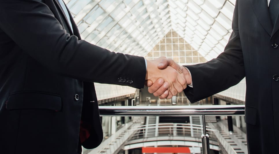 Two Cheerful Businessman Handshaking Helmet New Building 1